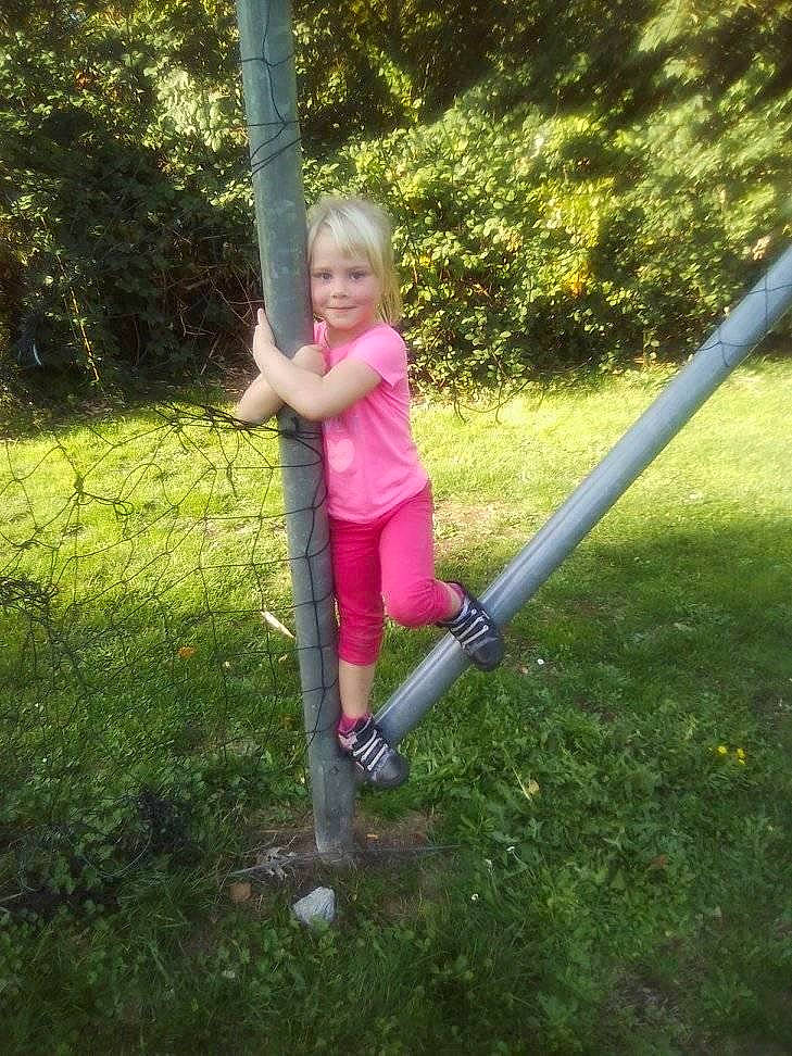 Ciara participe au concours pour gagner de l'argent avec cette photo : backyard, child, fun, grass, joy, lawn, leisure, outdoor_play_equipment, person, plant, play, playground, public_space, recreation, swing, toddler, tree, vacation