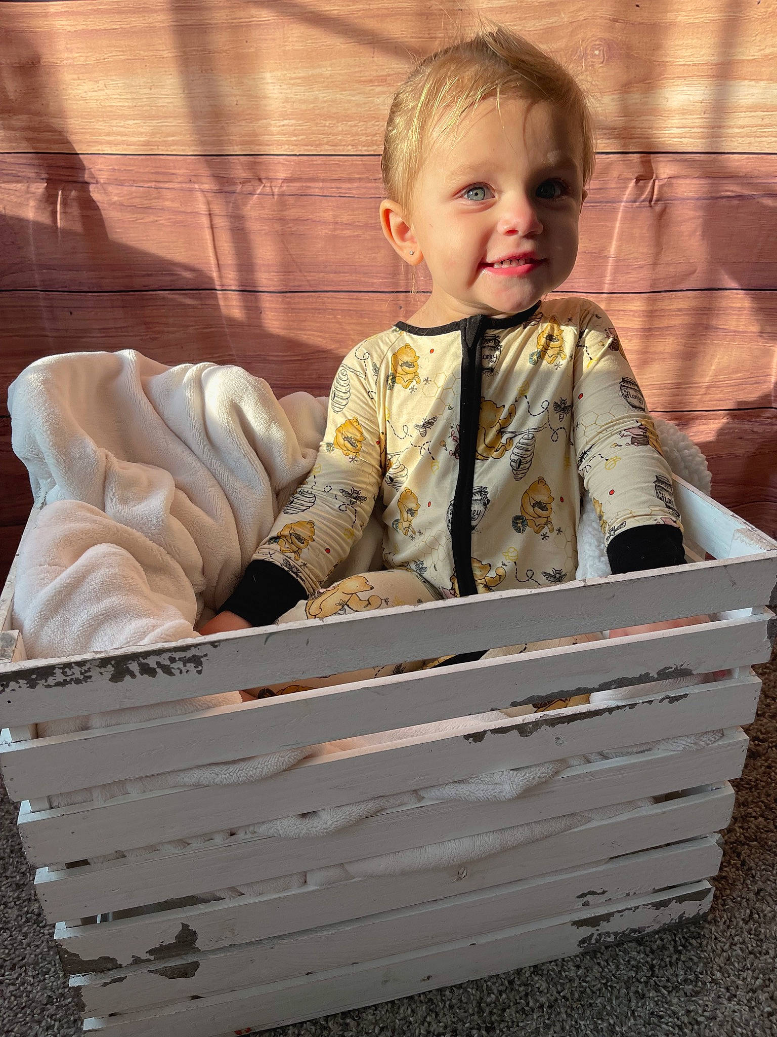 Mckenna is registered to the contest to win money with this photo: baby_toddler_clothing, basket, box, cart, child, crate, grass, hair, happy, hardwood, joy, people_in_nature, person, portrait_photography, product, rectangle, sitting, sleeve, smile, toddler