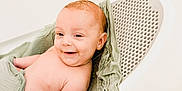 Kamden joined the competition — help win amazing prizes! baby, infant, smile, bath, bathroom, green_cloth, white_bath_seat, happy, skin, cute, child, person, sitting, wrapped, young, indoors, clean, relaxed, comfort, portrait