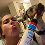 Volt a rejoint le concours — aidez-le/la à gagner de superbes lots ! woman, dog, selfie, indoor, playful, tongue_out, tube, bottle, pet, light, casual, earrings, furniture, table, background, face, hand, curious, expression, collar