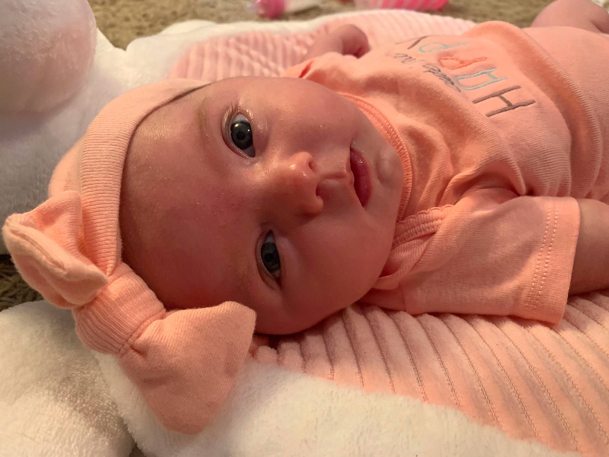 Kallie is registered to the contest to win money with this photo: baby, cheek, child, chin, comfort, eyebrow, eyelash, finger, happy, hat, iris, linens, lip, mouth, neck, nose, person, skin, sleeve, smile
