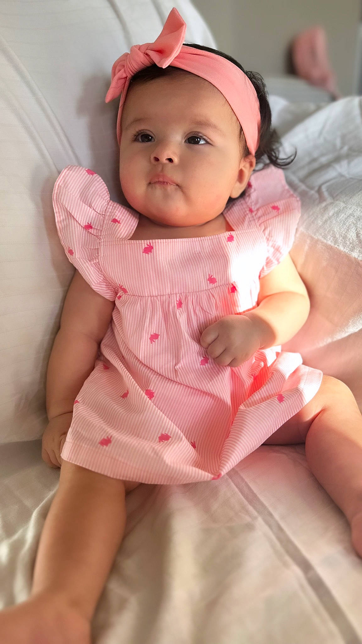 Annahlí joined the competition — help win amazing prizes! baby, baby_toddler_clothing, cap, cheek, comfort, dress, face, finger, hand, happy, headwear, human_body, human_leg, lip, pattern, person, pink, skin, sleeve, thigh