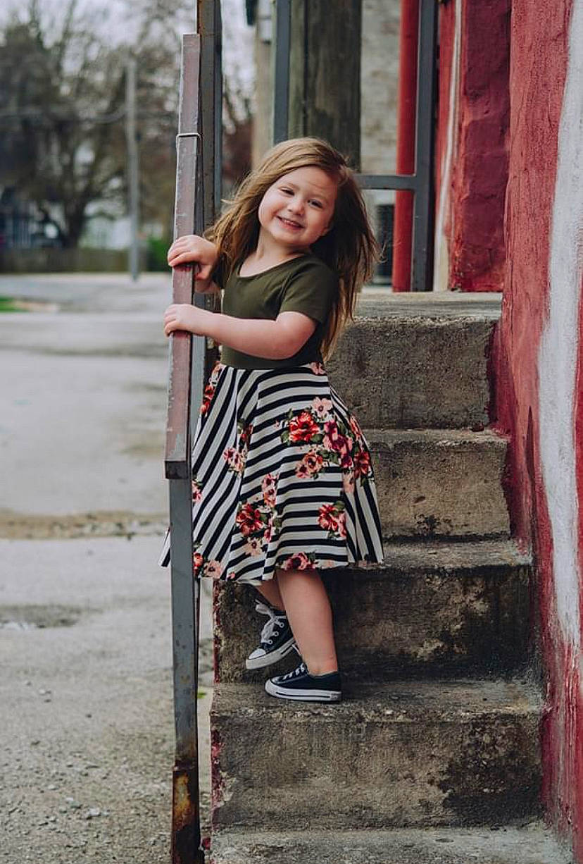 Landry joined the competition — help win amazing prizes! beauty, child_model, clothing, door, dress, fashion, footwear, joy, leg, long_hair, model, person, photo_shoot, photograph, photography, red, shoe, shoulder, smile, standing