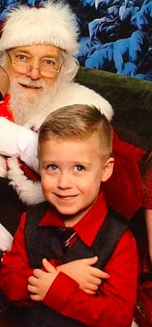 Cruz joined the competition — help win amazing prizes! beard, child, christmas, christmas_eve, event, facial_hair, fictional_character, grandparent, happy, headwear, holiday, joy, lap, person, photography, santa_claus, smile, toddler