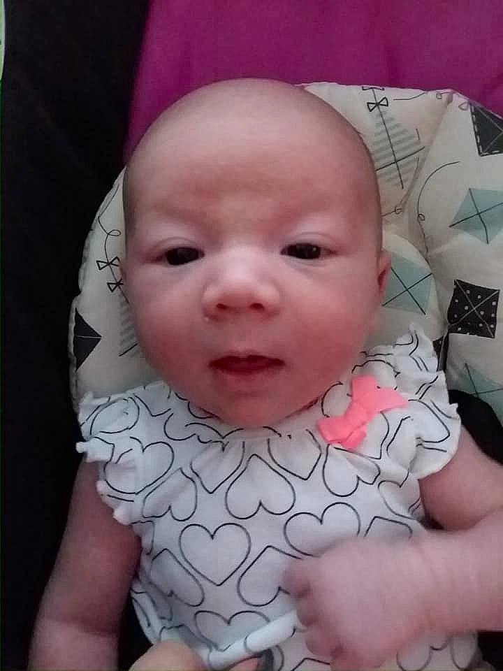 Jocelynn is registered to the contest to win money with this photo: cheek, child, chin, day, eye, eyebrow, face, finger, forehead, hand, head, infant, lip, mouth, nose, person, pink, product, skin, smile