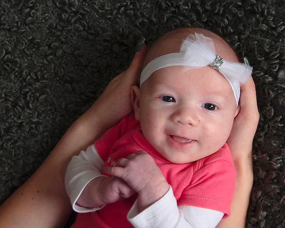 Jocelynn joined the competition — help win amazing prizes! cheek, child, finger, girl, hair_accessory, hand, headband, headgear, infant, person, pink, skin, smile, toddler