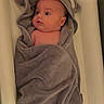 Julian joined the competition — help win amazing prizes! baby, towel, face, infant, cute, wrapped, soft, gray, ears, blanket, bed, newborn, child, person, indoors, lying, expression, adorable, skin, head