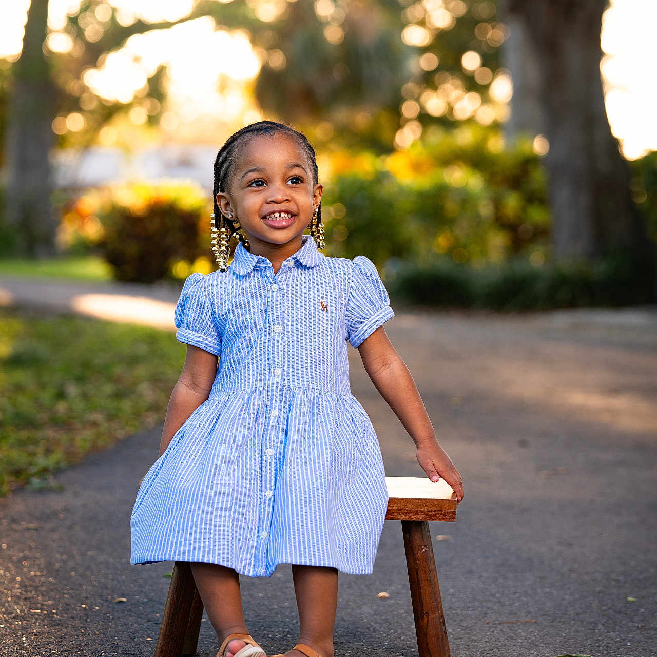 Jream is registered to the contest to win money with this photo: child, clothing, dress, face, female, footwear, formalwear, girl, happy, head, highheel, pants, person, photography, portrait, sandal, shoe, sitting, sleeve, smile