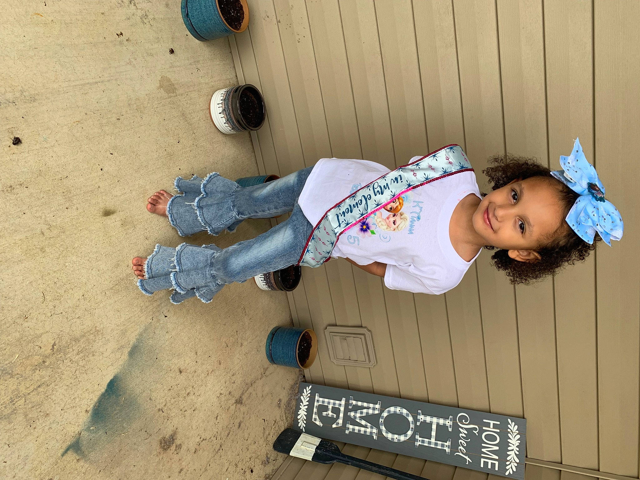 K'Tianna joined the competition — help win amazing prizes! baby_toddler_clothing, child, denim, fun, happy, hat, joy, leisure, person, shadow, sitting, sleeve, smile, soil, toddler, walking_shoe