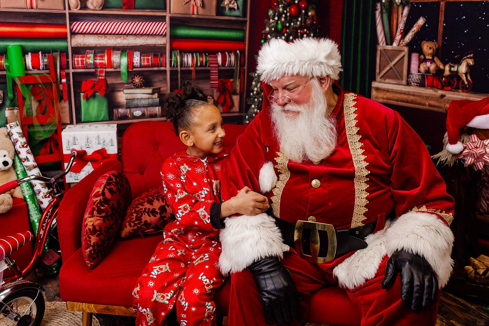 K'Tianna joined the competition — help win amazing prizes! beard, christmas, christmas_decoration, christmas_eve, costume_hat, event, facial_hair, fun, fur, happy, hat, headwear, holiday, joy, lap, person, red, santa_claus, sitting, tire