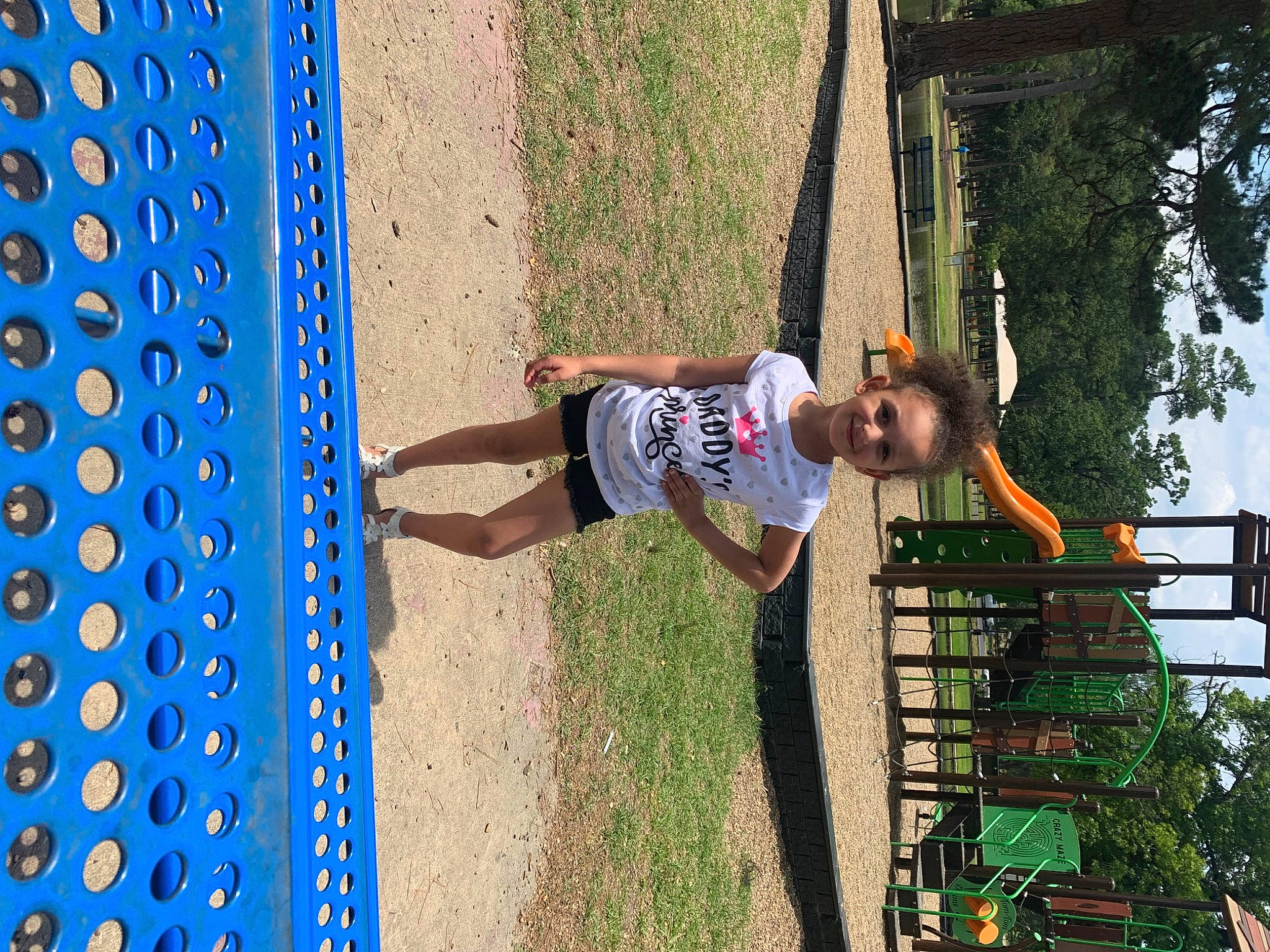 K'Tianna is registered to the contest to win money with this photo: blue, child, city, electric_blue, fun, grass, happy, joy, leisure, line, outdoor_play_equipment, pattern, people_in_nature, person, plant, play, playground, recreation, t_shirt, toddler