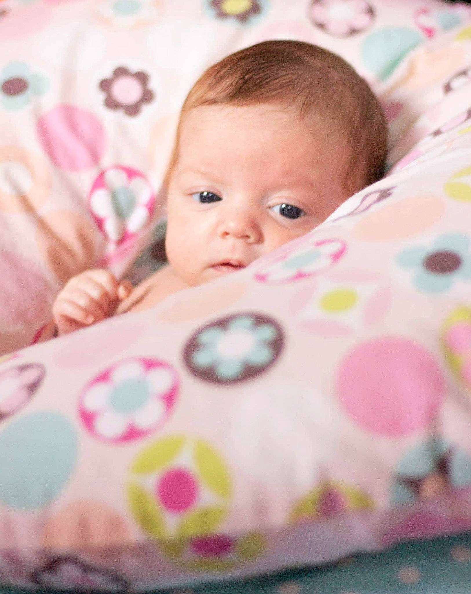 Raegan joined the competition — help win amazing prizes! baby, baby_products, bedding, blanket, cheek, child, linens, nap_mat, pattern, person, pink, product, skin, textile, toddler