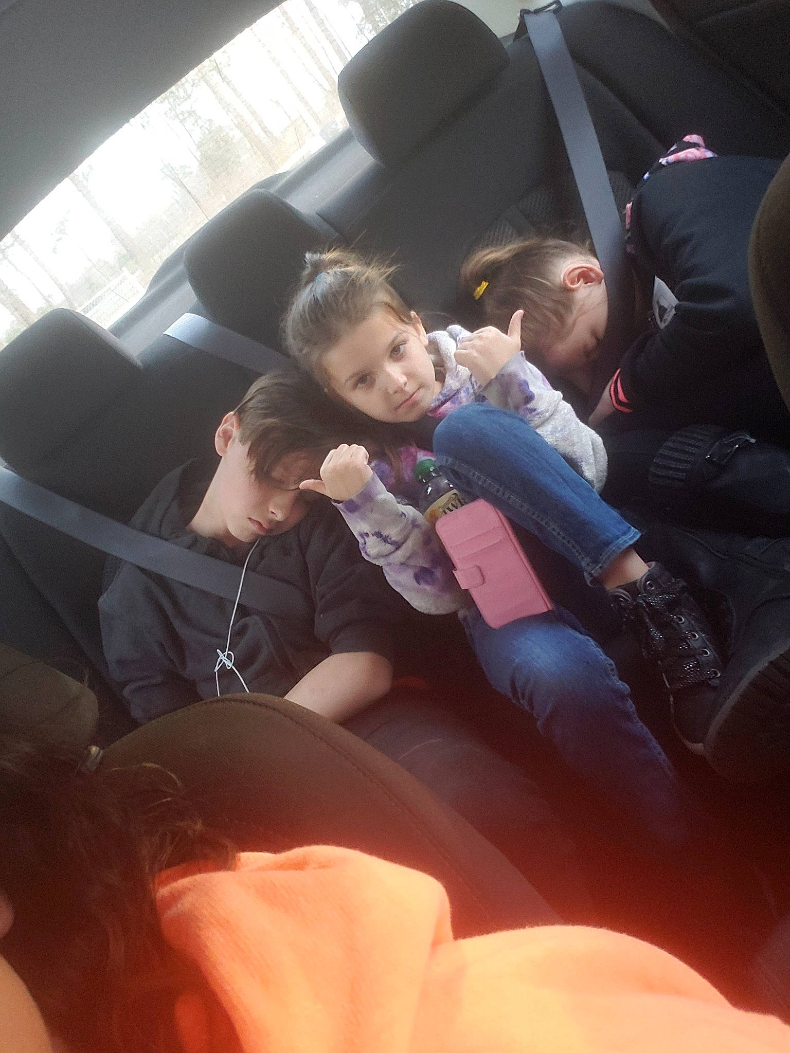 Maci is registered to the contest to win money with this photo: auto_part, car, car_seat, child, family_car, finger, fun, hand, lap, leg, luxury_vehicle, passenger, person, vacation, vehicle