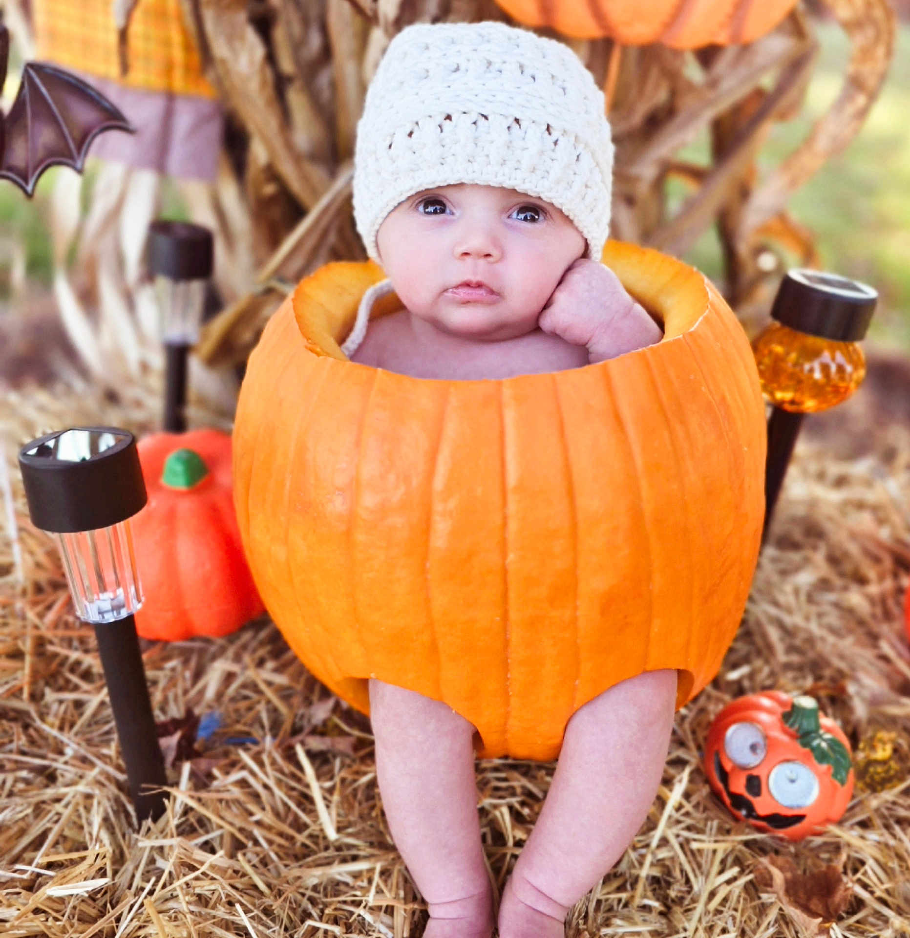 Zoey joined the competition — help win amazing prizes! baby, pumpkin, hat, outdoor, hay, hollowed_pumpkin, legs, halloween, decoration, cute, infant, knit_hat, fall, orange, festive, seasonal, portrait, child, decor, holiday