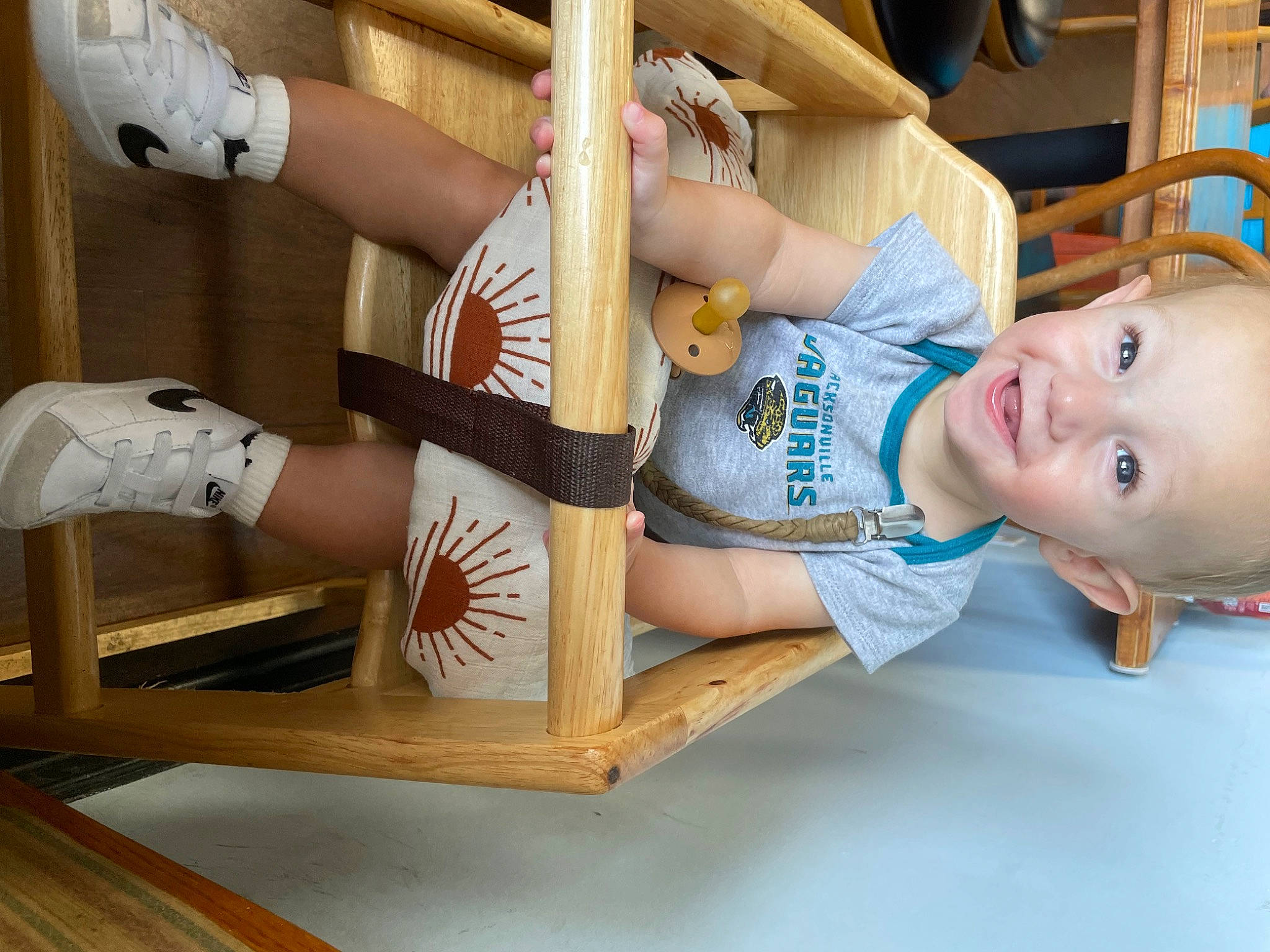 Brody is registered to the contest to win money with this photo: abdomen, baby, baby_toddler_clothing, comfort, elbow, foot, fun, happy, hardwood, human_body, human_leg, knee, leg, leisure, person, room, sitting, smile, thigh, toddler