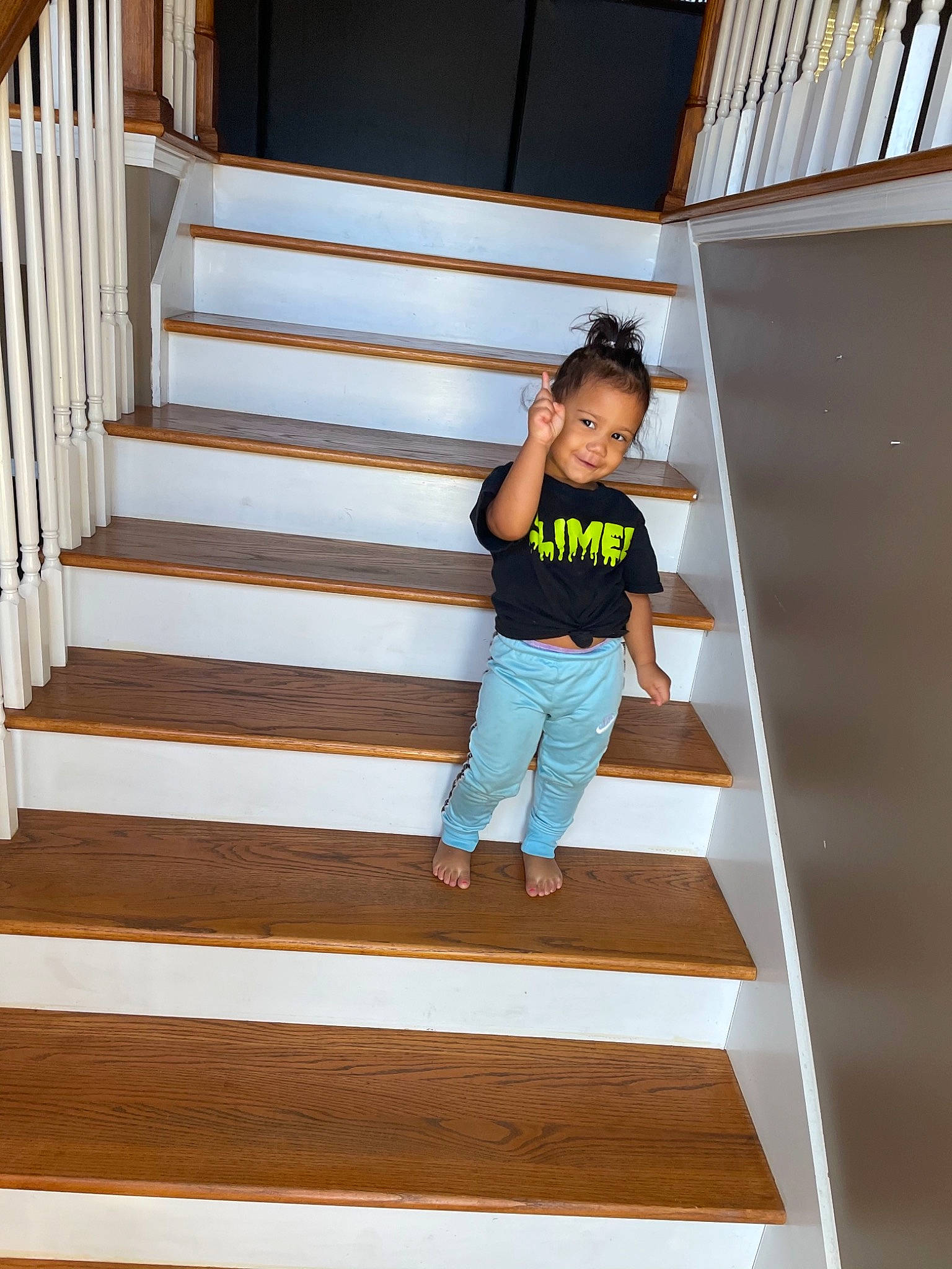 Iliana joined the competition — help win amazing prizes! active_pants, baluster, flooring, foot, handrail, hardwood, hip, home, joy, person, stairs, standing, sweatpant, wood, wood_flooring, wood_stain
