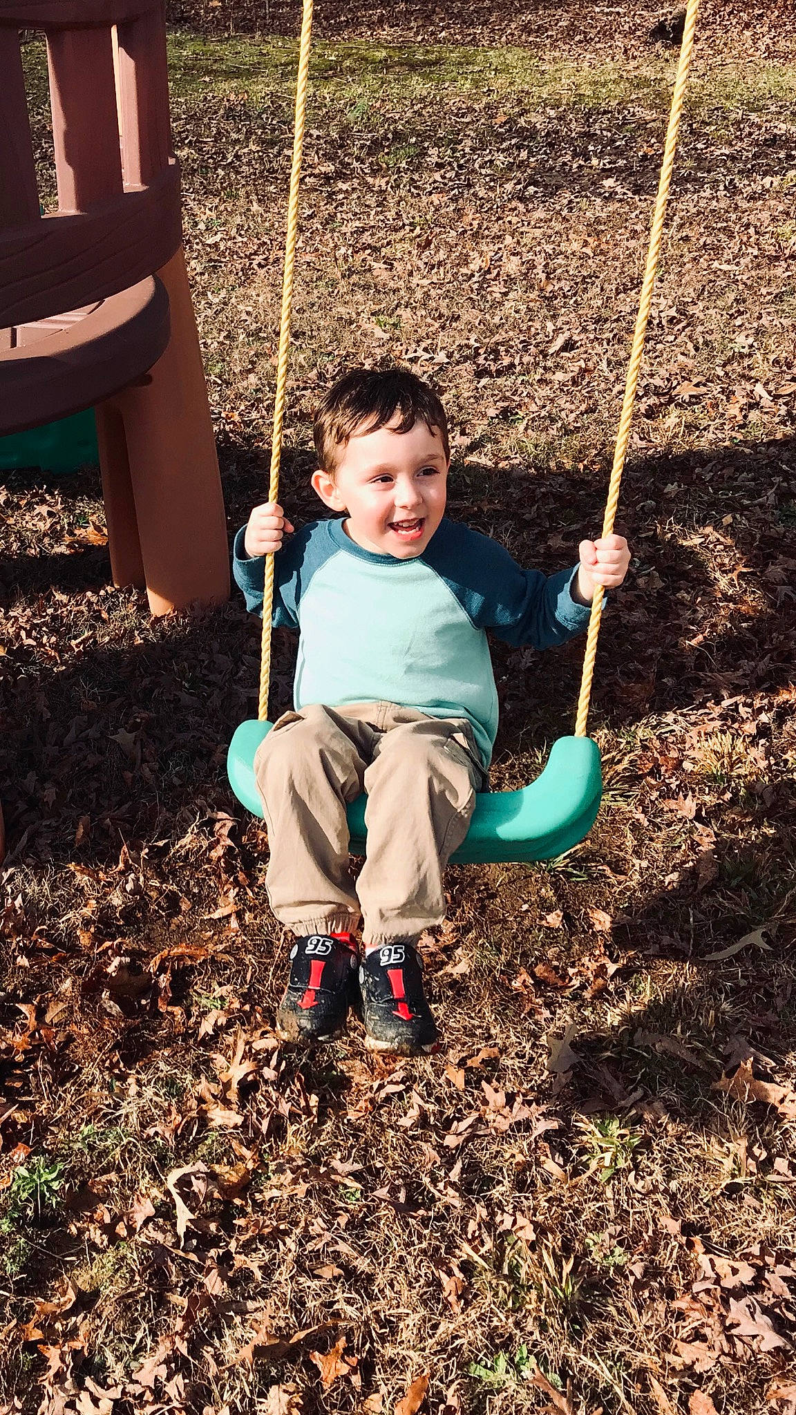 Azarias is registered to the contest to win money with this photo: child, fun, joy, leisure, outdoor_play_equipment, person, plant, play, playground, recreation, soil, swing, toddler, tree