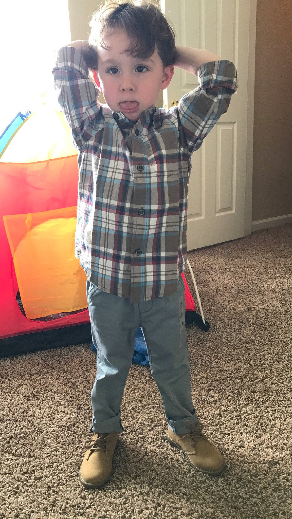 Azarias is registered to the contest to win money with this photo: child, child_model, cool, design, footwear, fun, jeans, male, outerwear, pattern, person, plaid, play, shoe, sleeve, standing, t_shirt, tartan, textile, toddler