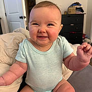 Dovey joined the competition — help win amazing prizes! arms, baby, bed, bedroom, candid, child, clothing, face, furniture, gummy_smile, hands, happy, home, indoors, infant, onesie, photography, portrait, sitting, smiling