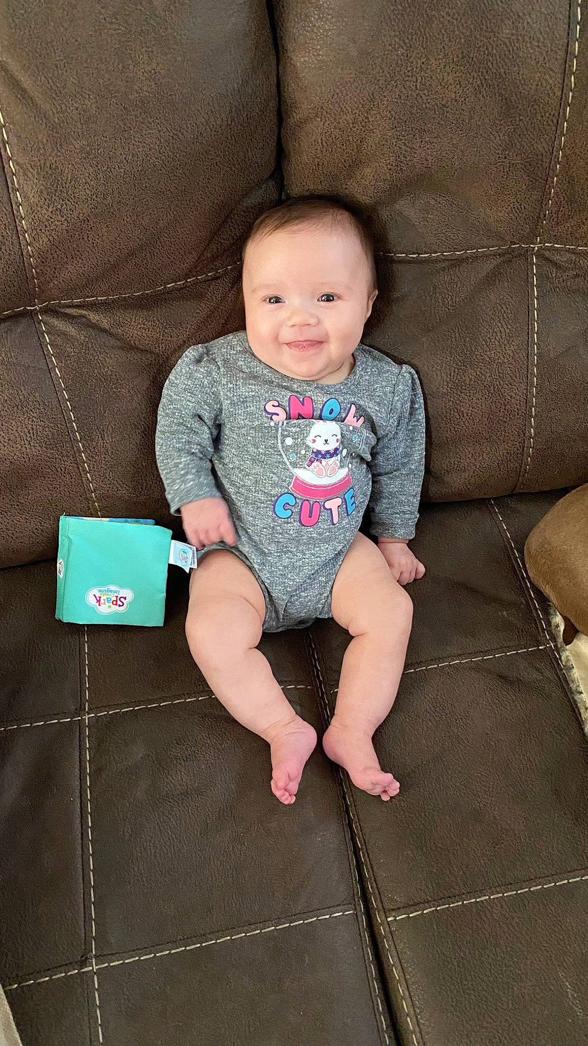 Meadow joined the competition — help win amazing prizes! baby, baby_toddler_clothing, cheek, child, comfort, couch, eye, face, foot, head, human_body, joy, knee, lap, person, skin, sleeve, smile, t_shirt, textile