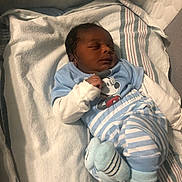 Ziyon joined the competition — help win amazing prizes! baby, newborn, sleeping, blue_clothing, striped_pants, mickey_mouse, blanket, infant, soft_toys, bed, cute, child, resting, cozy, indoors, person, newborn_baby, sock, small, peaceful