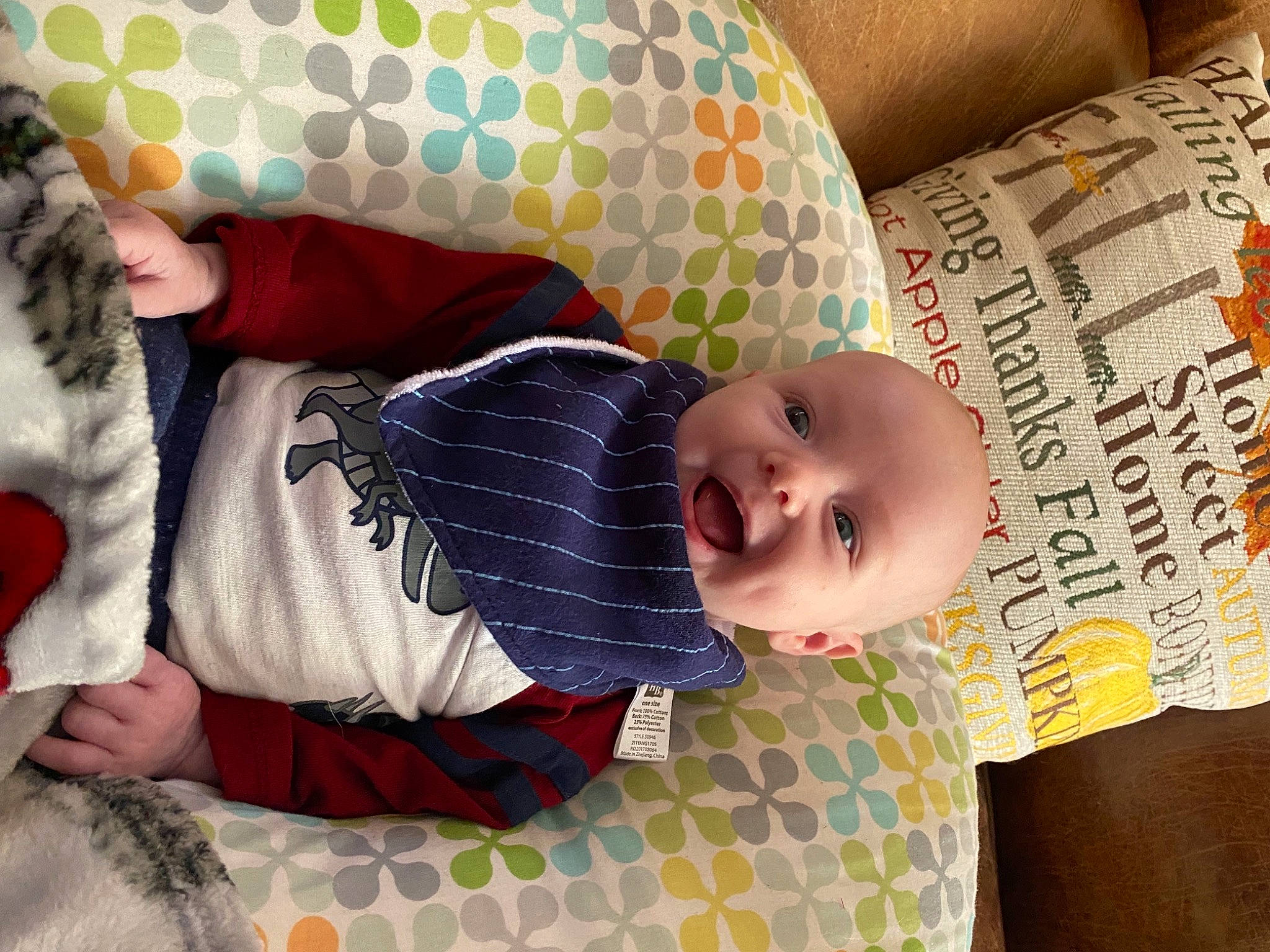 Mason is registered to the contest to win money with this photo: arm, baby, baby_products, baby_toddler_clothing, child, comfort, facial_expression, finger, hand, happy, human, linens, mammal, organ, pattern, people, person, room, smile, textile