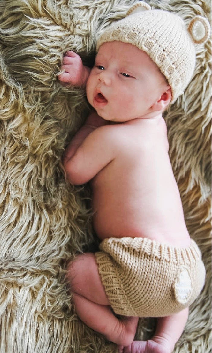Nicholas joined the competition — help win amazing prizes! baby, baby_sleeping, beige, child, child_model, fur, hat, headgear, headwear, person, photograph, photography, straw, toddler, wicker, wool