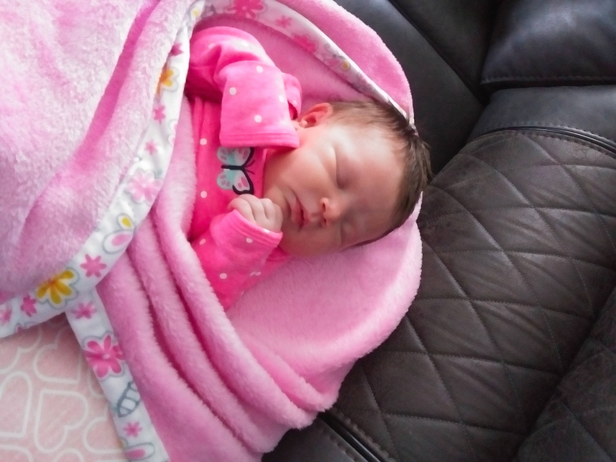 Mariah is registered to the contest to win money with this photo: baby, baby_products, baby_safety, baby_sleeping, baby_toddler_clothing, bedtime, cheek, child, comfort, couch, fashion_accessory, linens, magenta, nap, pattern, person, pink, sitting, sleep, textile