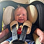 baby, car_seat, child, smile, infant, seatbelt, clothing, safety, cute, happy, straps, face, headrest, young_child, indoor, person, seat, toddler, hands, hair