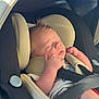 baby, car_seat, sleeping, child, infant, seatbelt, safety, cushion, hair, clothing, transportation, indoors, peaceful, rest, newborn, cute, portrait, seat, soft, daylight