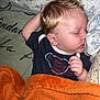 Arthur a rejoint le concours — aidez-le/la à gagner de superbes lots ! baby, bed, blanket, blue, child, clothing, comfort, cozy, cute, face, hair, hand, indoor, orange, peaceful, pillow, rest, sleeping, soft, toddler