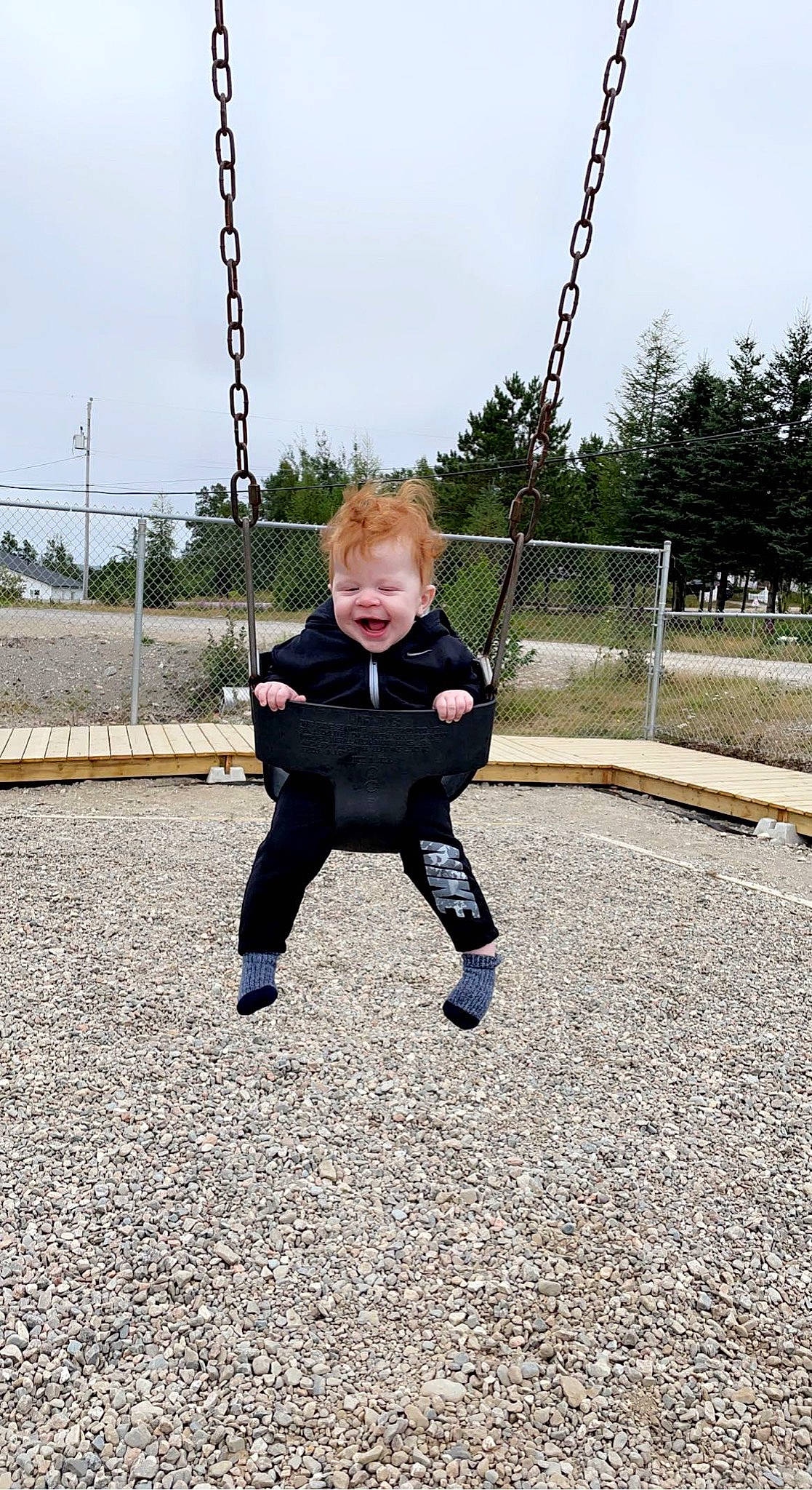 Cole joined the competition — help win amazing prizes! baby, baby_toddler_clothing, city, cloud, electric_blue, fun, grass, happy, leisure, outdoor_play_equipment, people_in_nature, person, plant, playground, recreation, sky, sleeve, swing, t_shirt, toddler