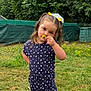 Yléana participe au concours pour gagner de l'argent avec cette photo : child, girl, flower, yellow_flower, romper, hearts_pattern, grass, garden, greenery, dandelions, nature, outdoor, pigtails, hair_accessories, cute, young_child, summer, playful, posing, portrait
