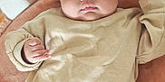 Syana participe au concours pour gagner de l'argent avec cette photo : baby, beige, blanket, child, clothing, comfort, cozy, curious, cute, expression, indoors, infant, lying_down, playful, portrait, rainbow, small_hands, soft_texture, toy, warm