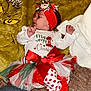 Nathania joined the competition — help win amazing prizes! baby, infant, christmas, holiday, festive, tutu, red_bow, headband, santa, blanket, lights, carpet, clothing, cute, indoors, toddler, celebration, holiday_decor, person, smiling