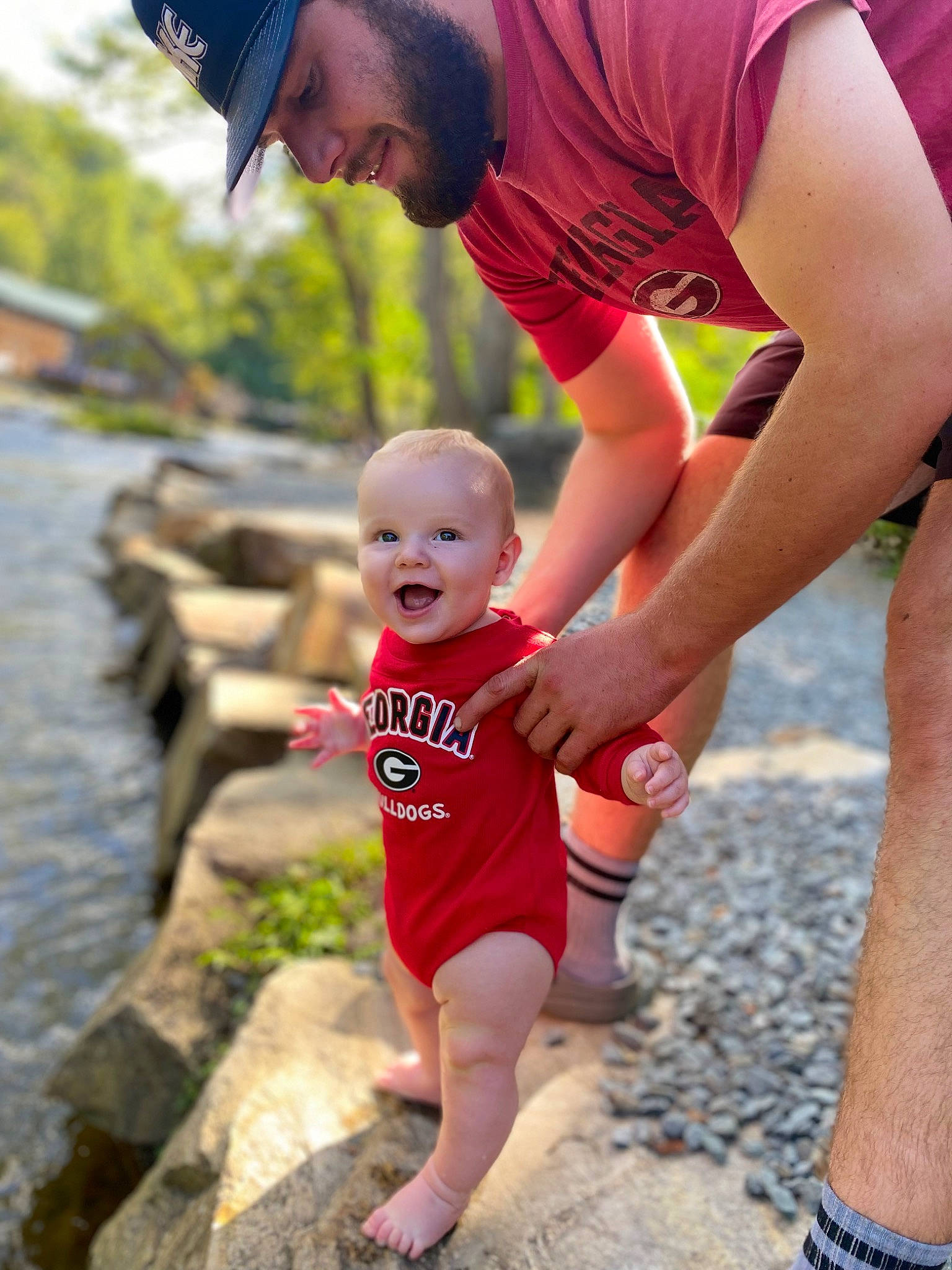 Stetson is registered to the contest to win money with this photo: child, event, face, fun, grass, happy, hat, headwear, human_leg, leisure, muscle, people_in_nature, person, plant, recreation, shorts, smile, t_shirt, thigh, toddler