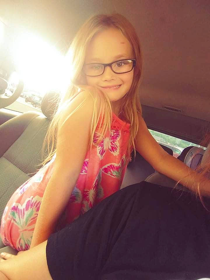 Serenity is registered to the contest to win money with this photo: black_hair, comfort, elbow, eyewear, finger, flash_photography, glasses, grass, happy, joint, joy, knee, leg, neck, person, shoulder, smile, thigh, tints_and_shades, trunk