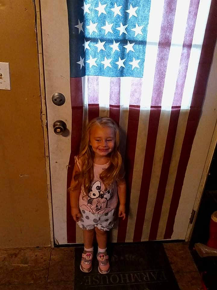Everley is registered to the contest to win money with this photo: beauty, child, door, event, fashion, flag, flag_of_the_united_states, flooring, fun, human_leg, joy, pattern, person, pink, sandal, shorts, smile, sock, standing, thigh