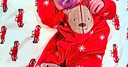 Cassidy joined the competition — help win amazing prizes! baby, bed, blanket, closeup, cozy, cute, face, footie_pajamas, hand, holiday_pajamas, infant, newborn, onesie, pacifier, portrait, red_clothing, reindeer, smile, soft_toy, truck_pattern