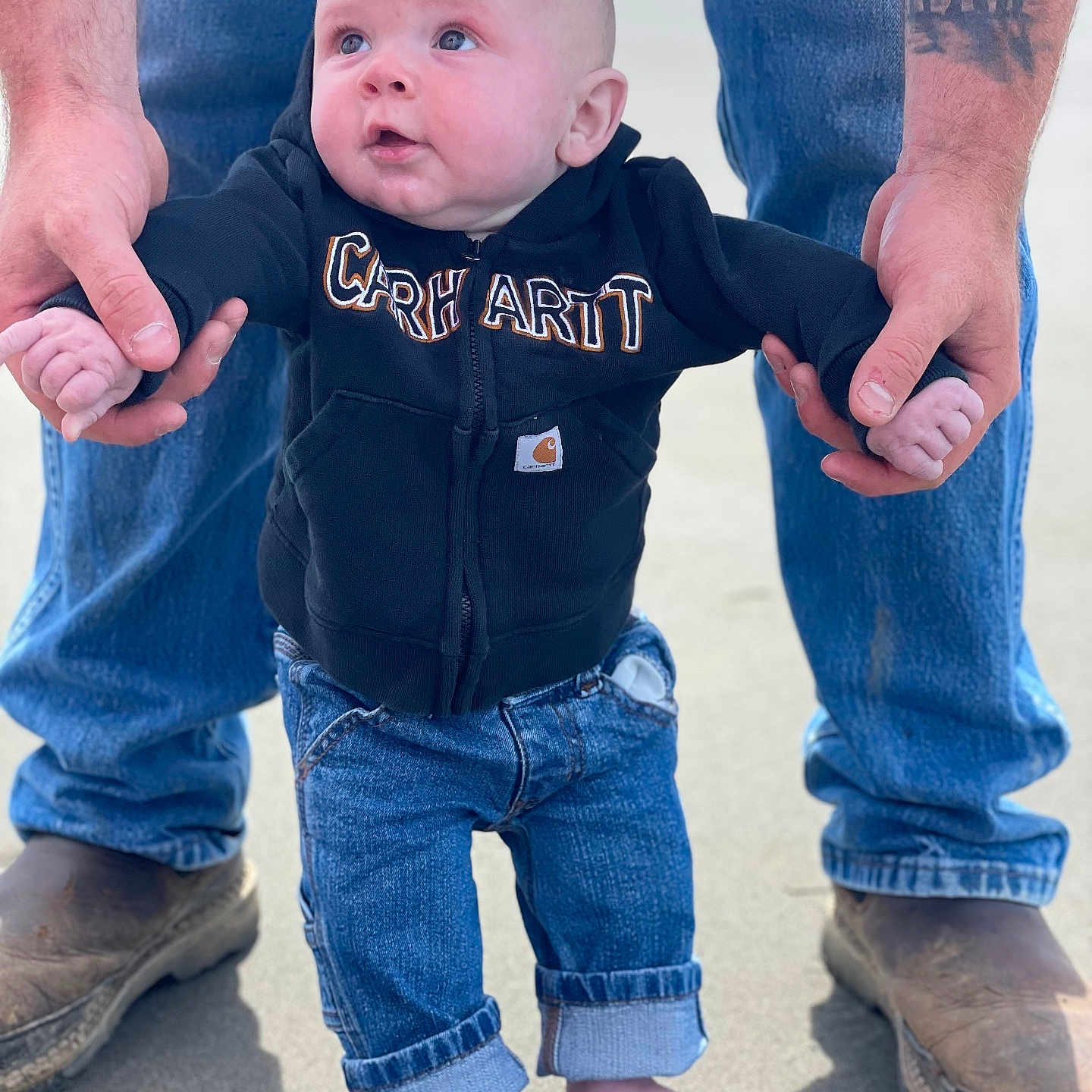 Lloyd is registered to the contest to win money with this photo: baby, bodypart, clothing, coat, face, finger, footwear, hand, head, jacket, jeans, knitwear, longsleeve, pants, person, photography, portrait, shoe, sleeve, walking