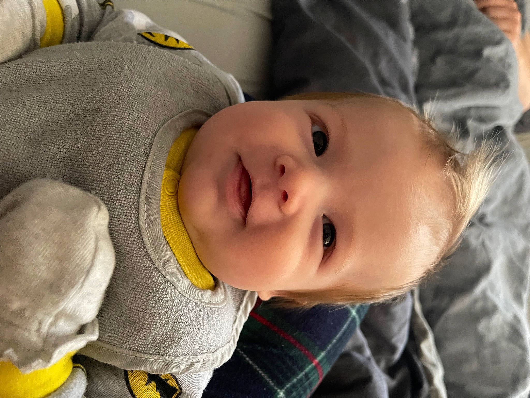 Sutton is registered to the contest to win money with this photo: baby, baby_toddler_clothing, cheek, child, comfort, eye, eyebrow, face, fun, happy, mammal, nose, person, portrait_photography, sitting, skin, sleeve, smile, toddler, tree