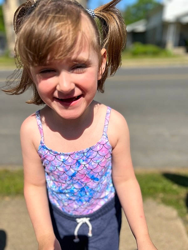 Kinslee Rae is registered to the contest to win money with this photo: clothing, cool, fun, grass, hair, hairstyle, happy, head, iris, joint, joy, leisure, neck, person, pink, plant, shoulder, smile, summer, toddler