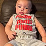 Julian joined the competition — help win amazing prizes! baby, infant, child, puma, clothing, grey_outfit, sleeveless_shirt, shorts, leather_surface, carpet, indoor, person, cute, young_child, relaxed, seated, skin, face, expression, hand