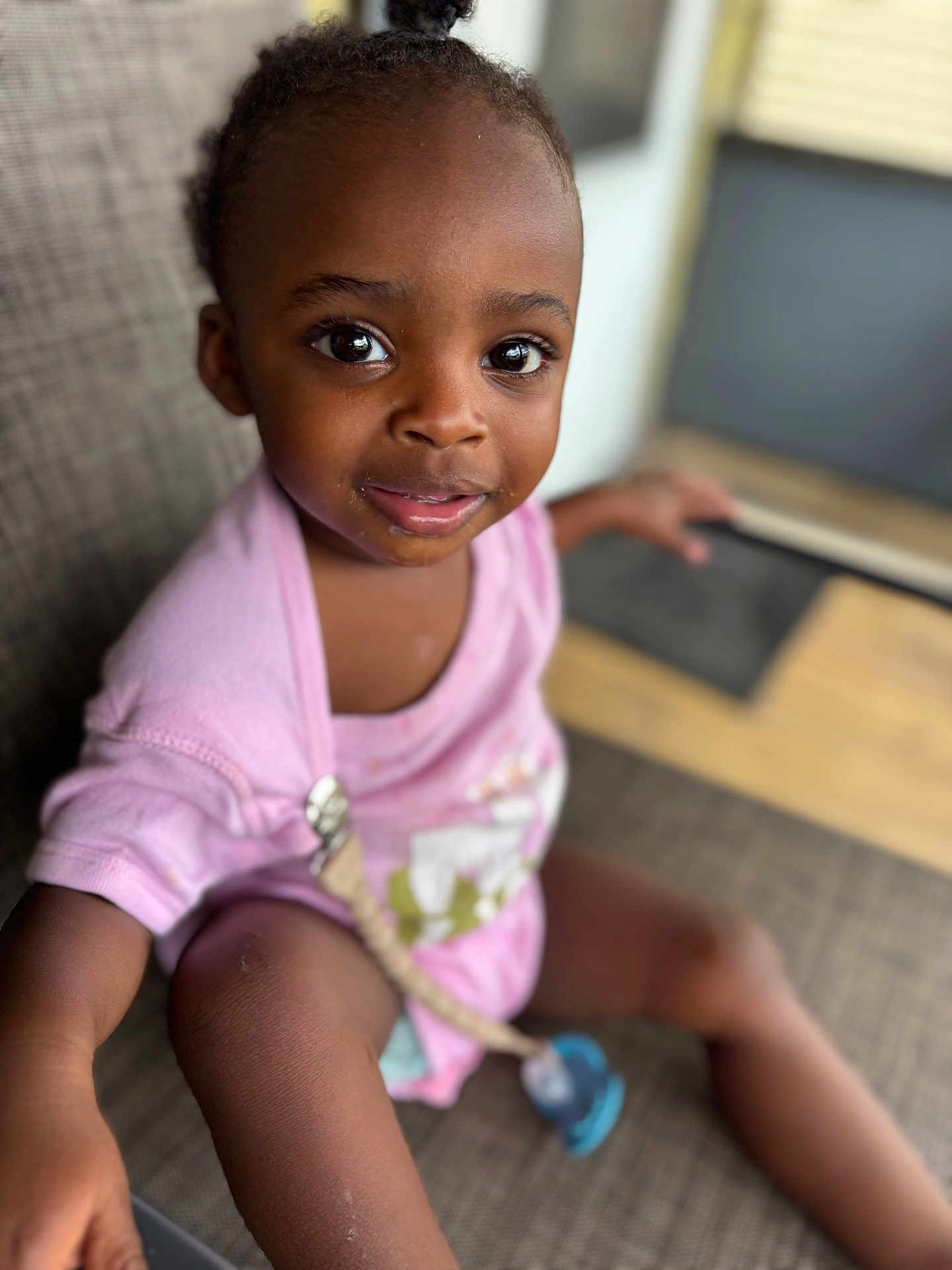 Amory joined the competition — help win amazing prizes! toddler, child, face, eyes, pink_shirt, pacifier, sitting, couch, indoor, expression, skin, hair, cute, person, portrait, clothing, furniture, blurred_background, happy, young_child