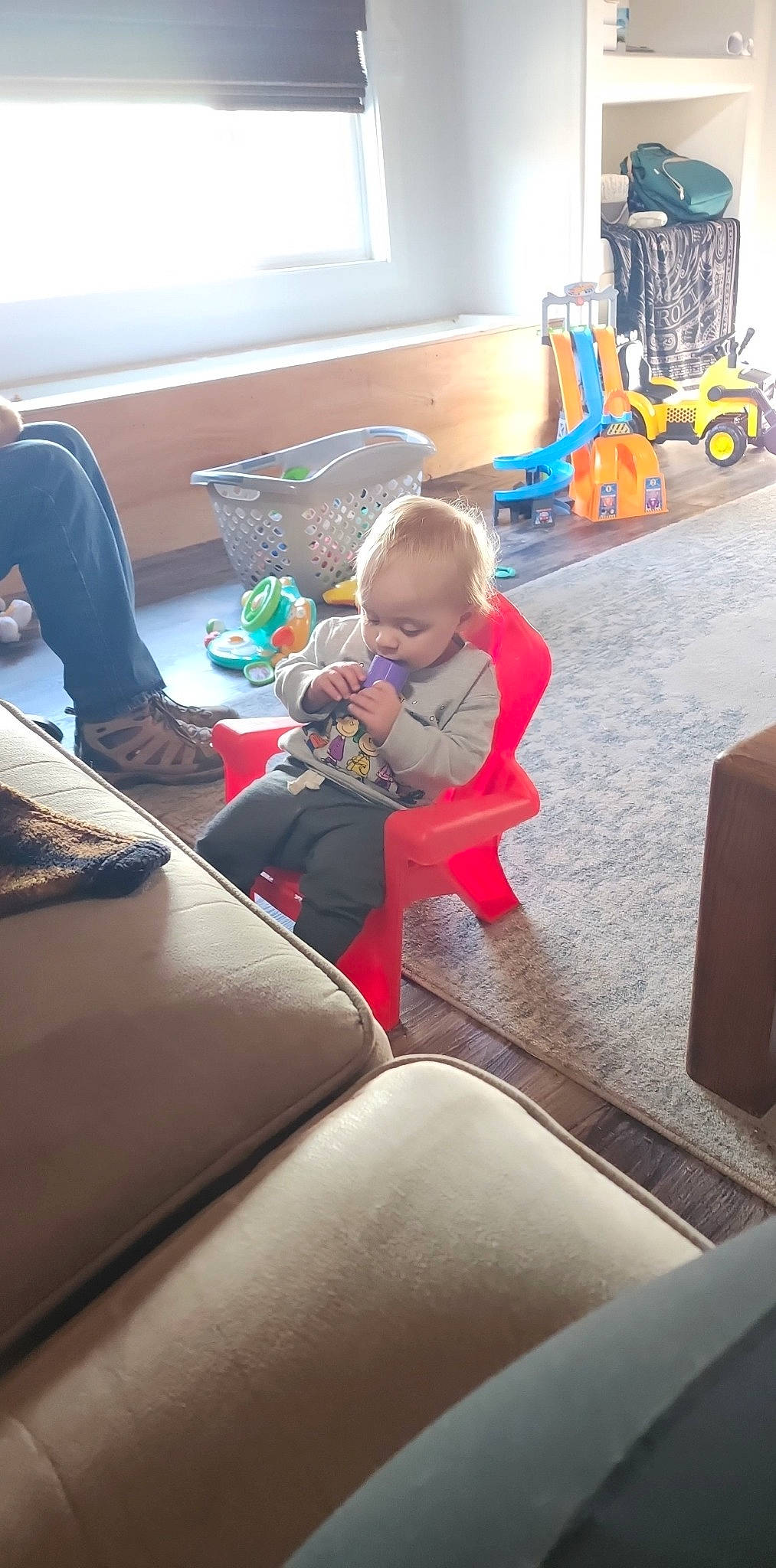 Kain joined the competition — help win amazing prizes! automotive_exterior, baby, carmine, child, comfort, flooring, fun, lap, leisure, living_room, motor_vehicle, person, play, recreation, room, sitting, toddler, toy, toy_vehicle, vacation