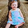 Maylin is registered to the contest to win money with this photo: baby, barefoot, blue_bows, child, colorful_clothing, cute, dress, grass, happy, leaves, nature, outdoor, person, portrait, sitting, skin, smiling, toddler, tree_trunk, young_child