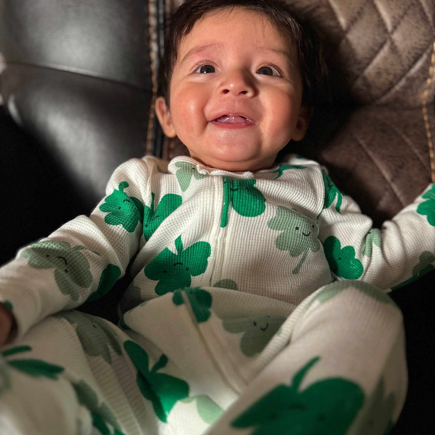 Liam is registered to the contest to win money with this photo: baby, babylaughing, bodypart, clothing, couch, face, finger, furniture, hand, happy, head, knitwear, laughing, newborn, pajamas, person, photography, portrait, smile, sweater