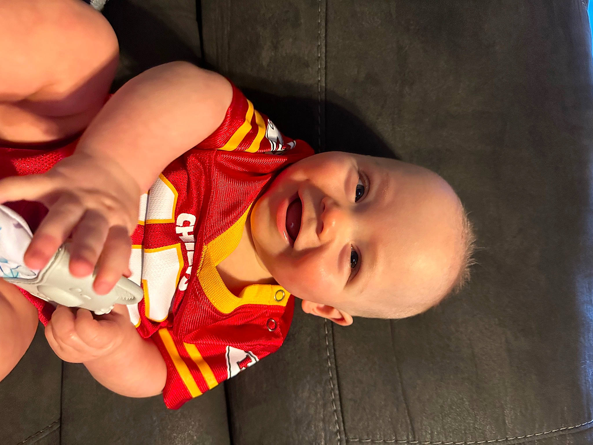 Gunner joined the competition — help win amazing prizes! baby, baby_toddler_clothing, elbow, finger, fun, gesture, hand, happy, human_body, human_leg, lip, mouth, nail, nose, person, product, skin, smile, thumb, toddler