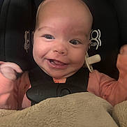 Kinsley joined the competition — help win amazing prizes! baby, infant, smile, face, car_seat, blanket, pacifier, clothing, child, happy, cute, person, seatbelt, indoors, closeup, head, expression, baby_girl, baby_boy, adorable