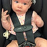 Kinsley is registered to the contest to win money with this photo: baby, car_seat, child, infant, polka_dot, seatbelt, pacifier, clothing, sitting, straps, black, pink, cute, indoor, person, young_child, safety, blurred, expression, portrait